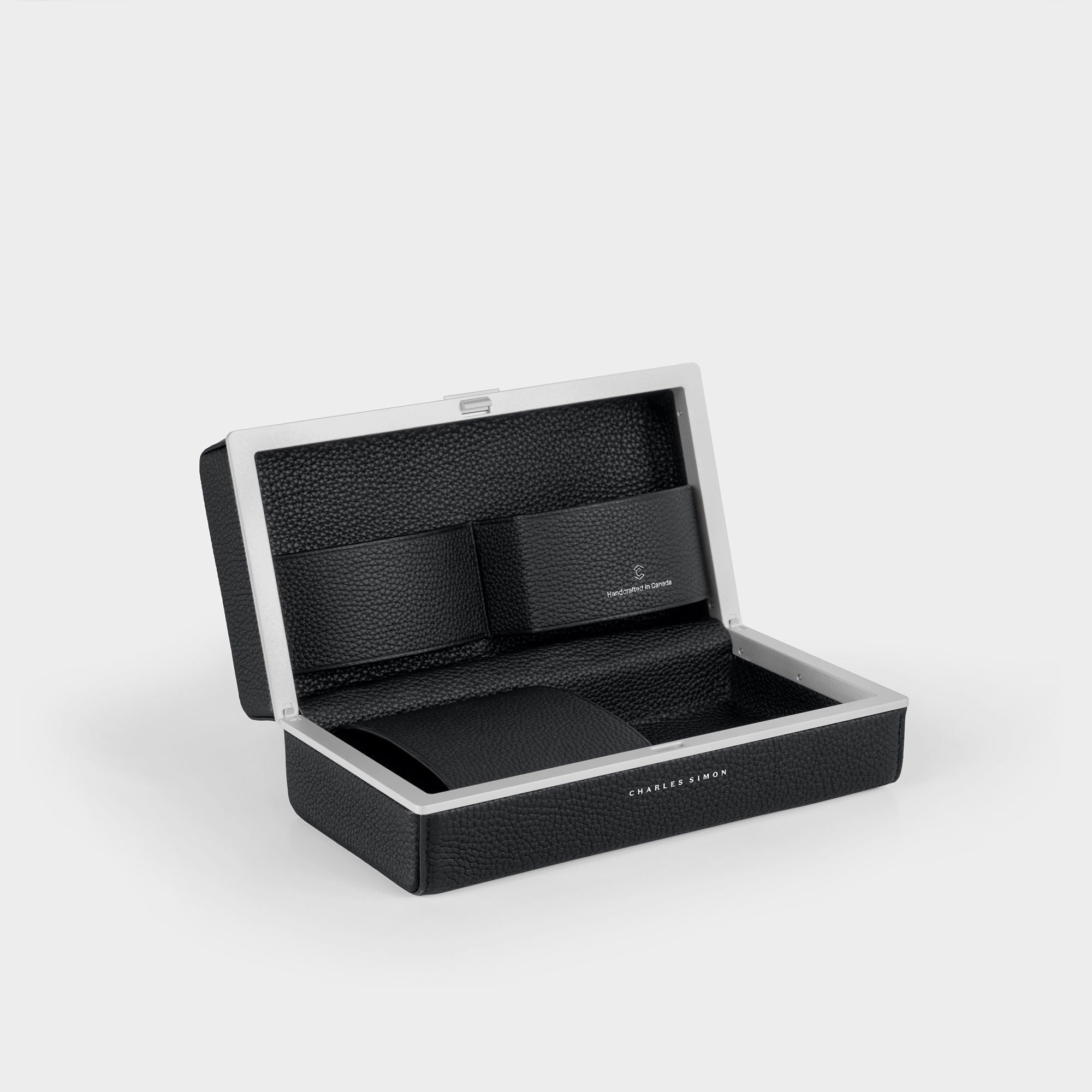 Charles Simon Moraine toiletry case in black interior view showcasing the convenient leather compartments