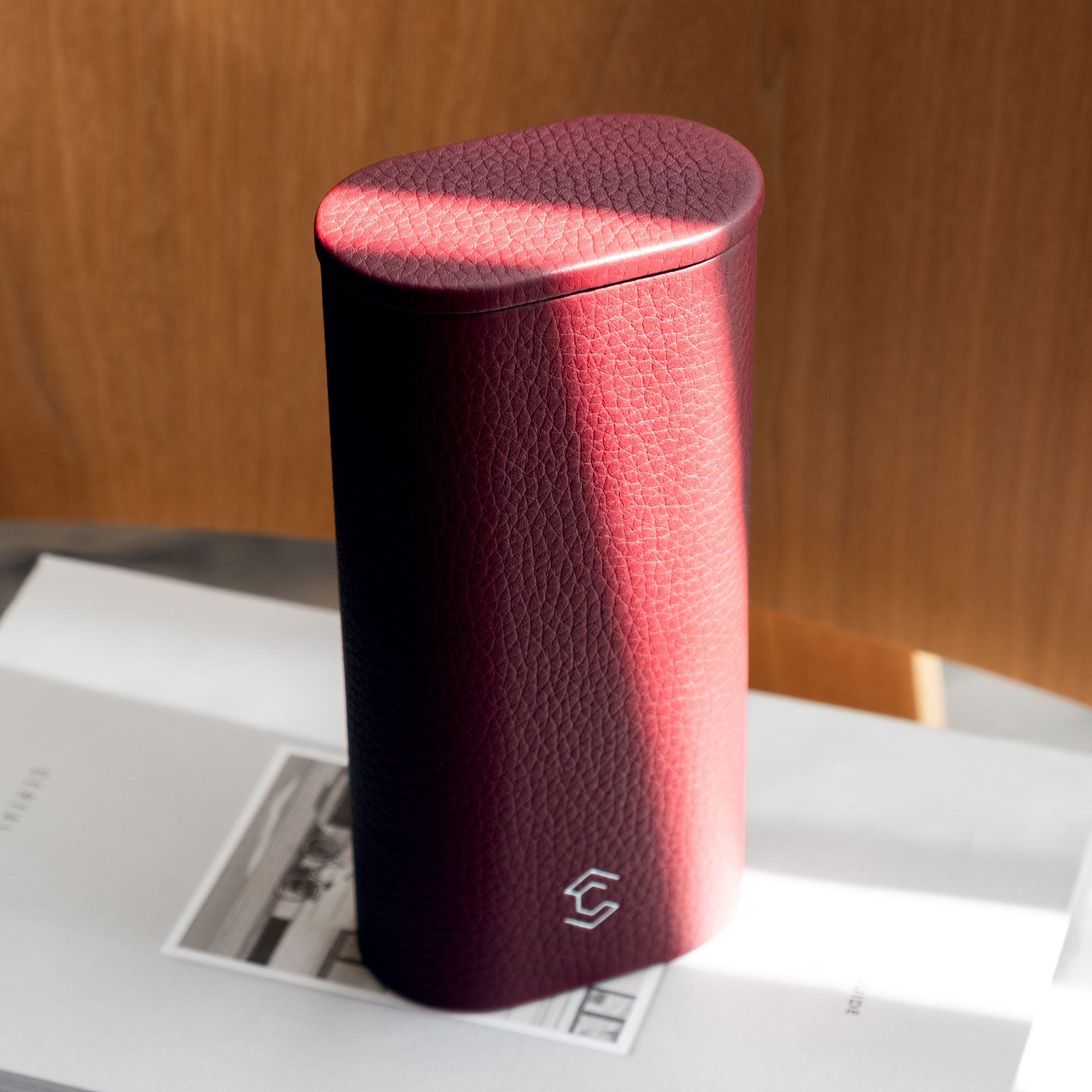 Leather watch roll with a minimalist, compact design, ideal for safely carrying a single watch while traveling.