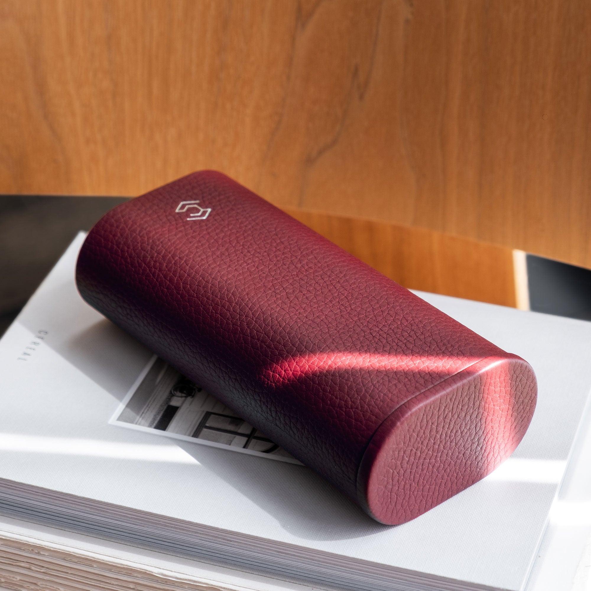 Travel watch roll handmade in Canada from refined materials, offering premium protection for a watch with strap, in burgundy leather.