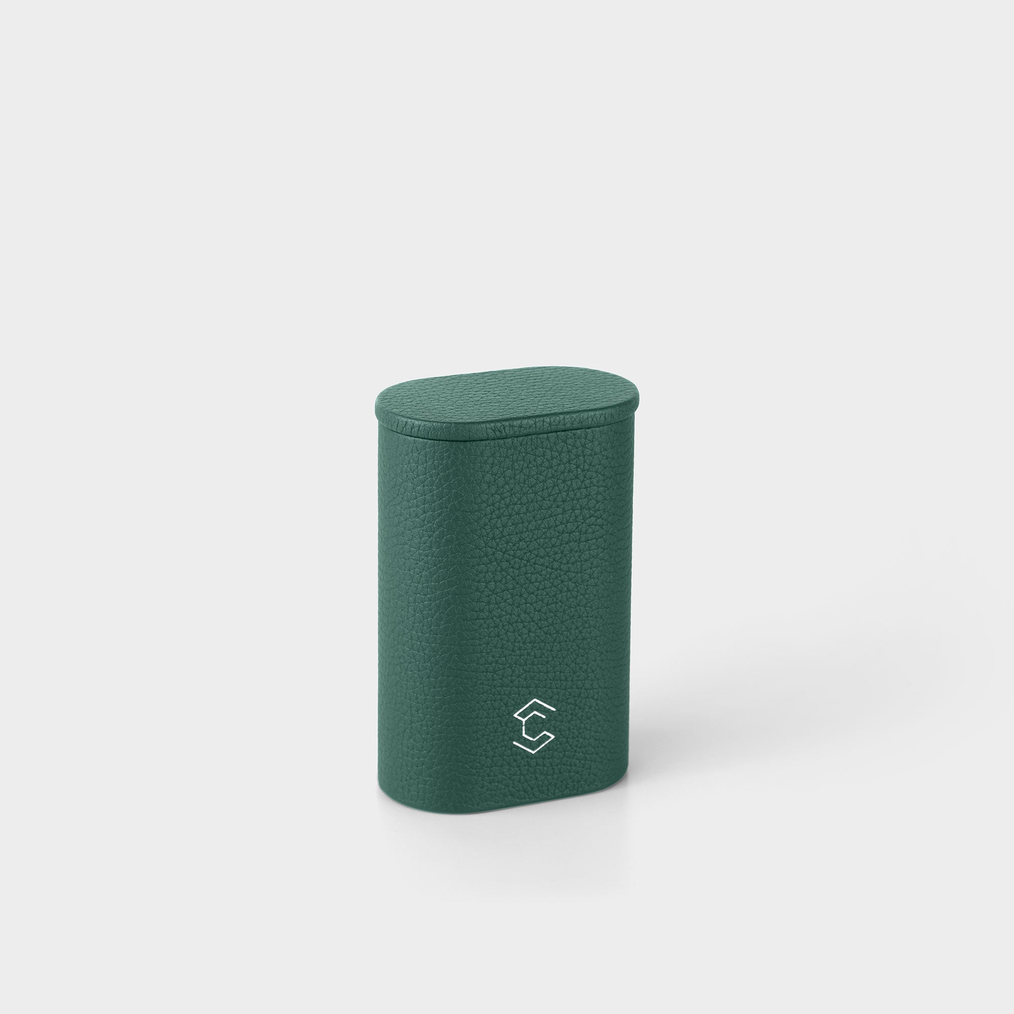 Product photo of closed upright Oscar 1  Travel Watch roll. Handmade from emerald green leather to store and transport one watch with a metal bracelet.