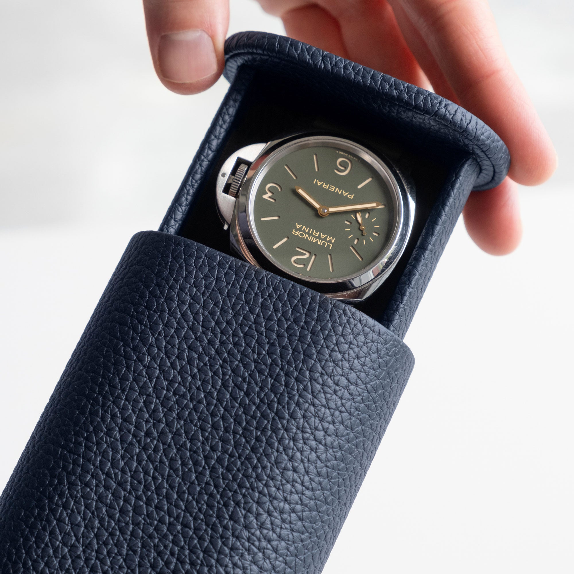 Travel watch roll marine leather, single watch case, sleek compact design for safe transportation.