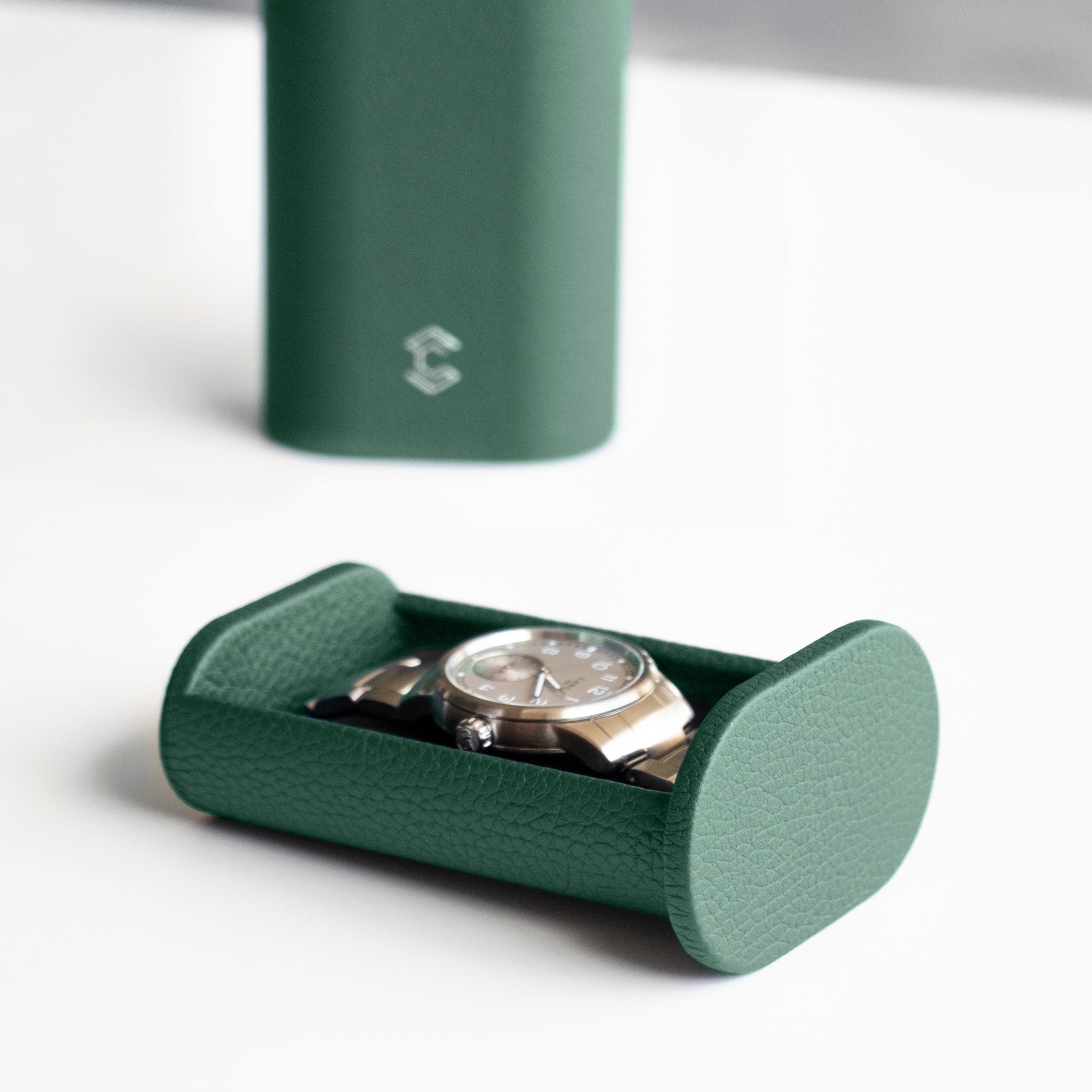 Emerald leather travel watch roll for one watch with a metal bracelet. Handmade in Canada by Charles Simon.