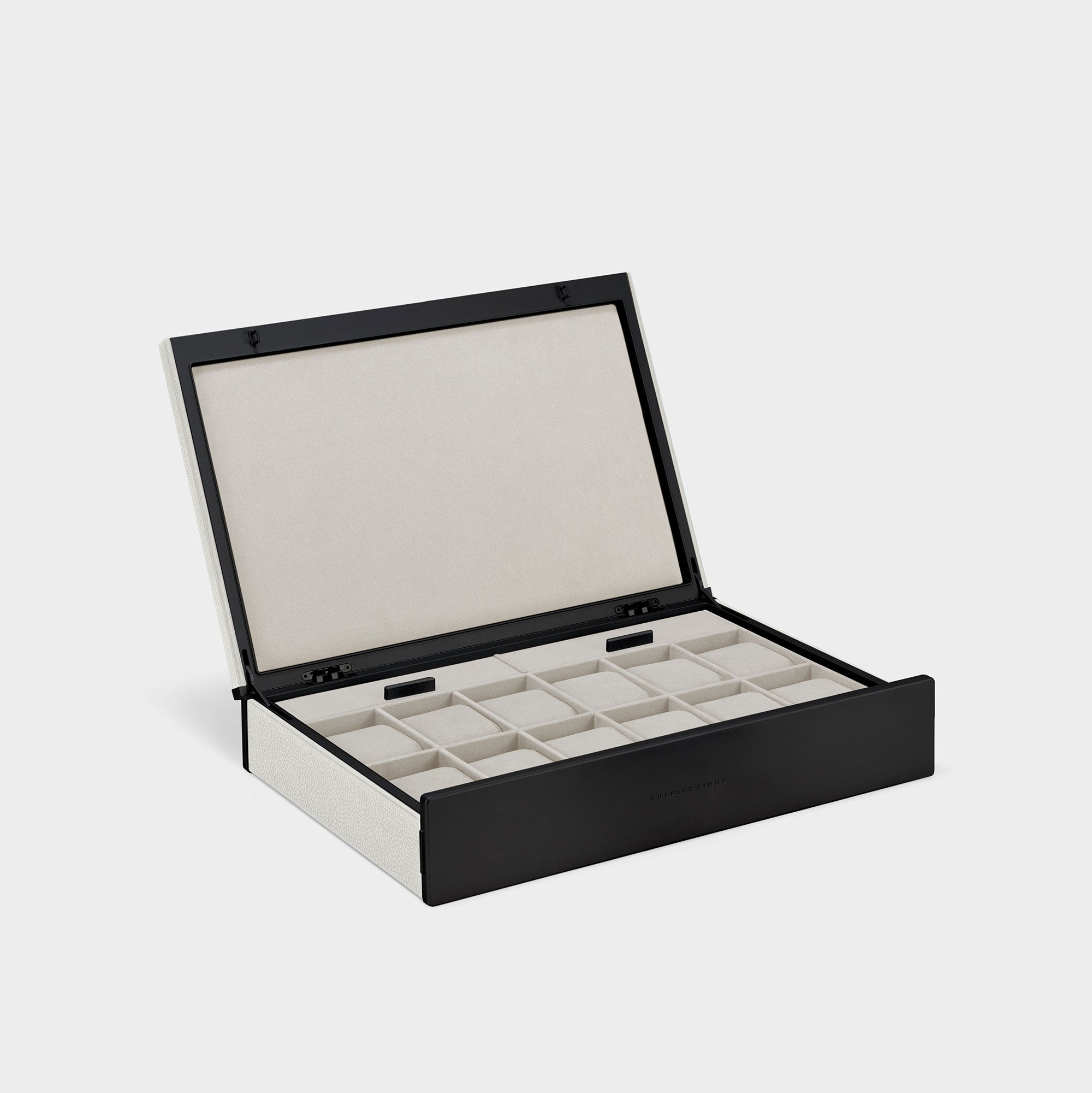 Product photo of open handmade watch box for 12 watches in white leather, black carbon fiber and anodized aluminum casing and alabaster Alcantara interior