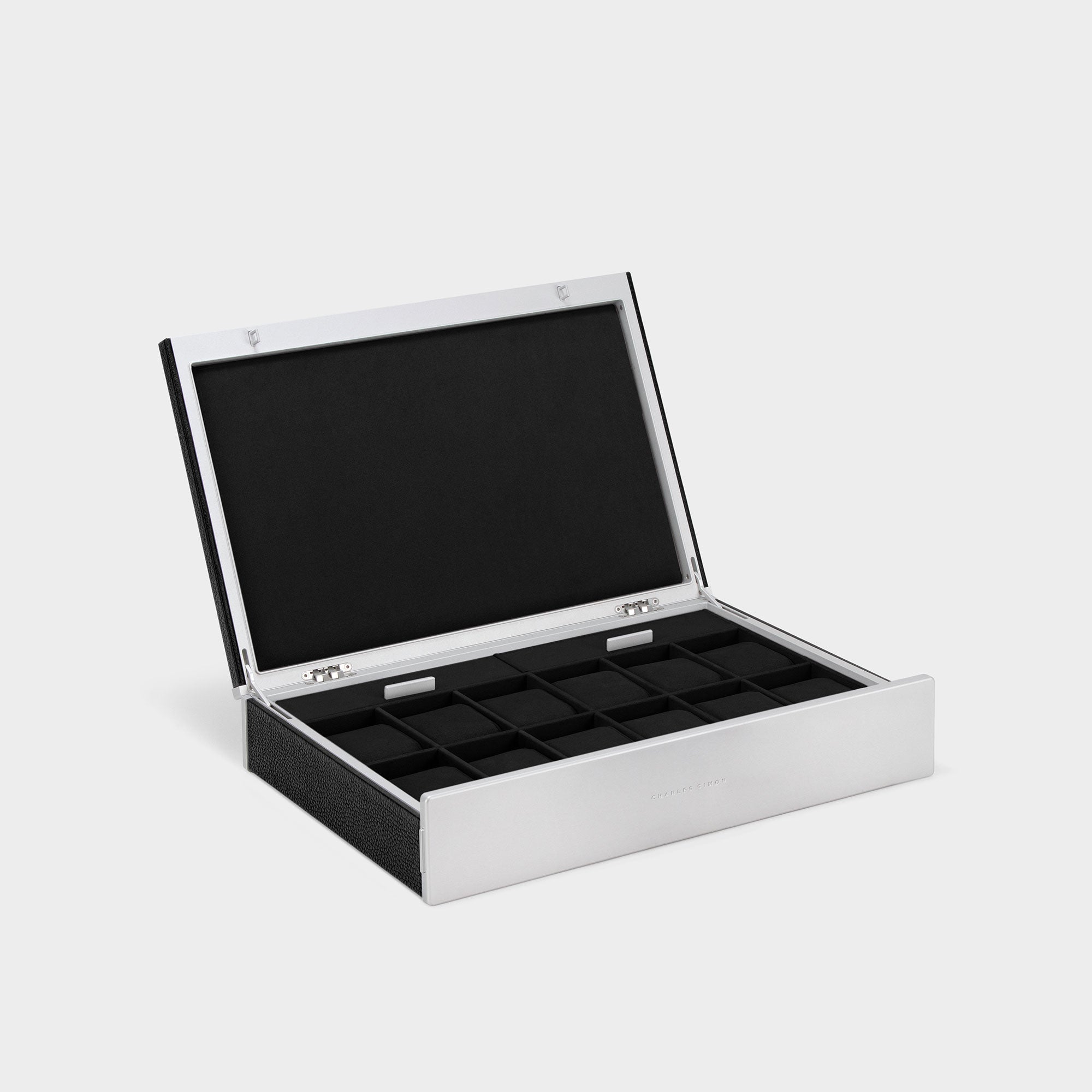 Product photo of open Spence 12 Watch box in black leather, grey carbon fiber and anodized aluminum casing and notte Alcantara interior lining.