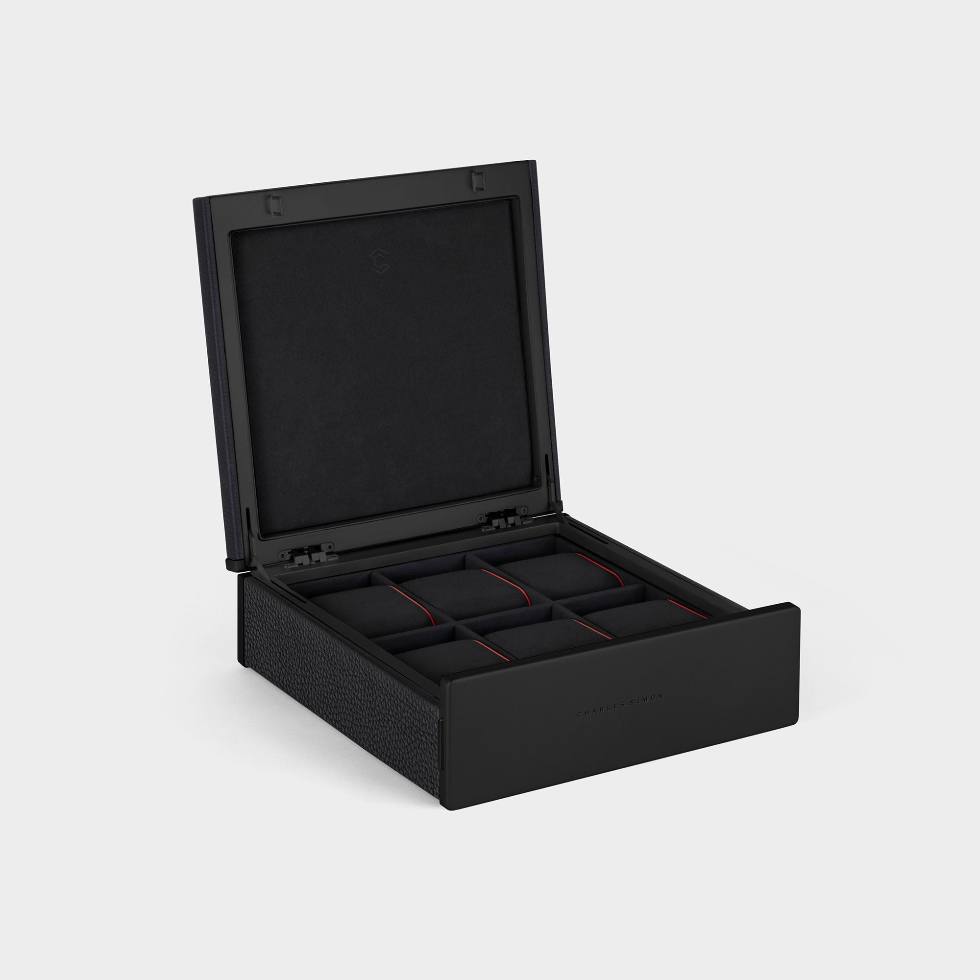 Handmade watch box for 6 watches in black leather, black carbon fiber and anodized aluminum casing and Notte Alcantara interior with Notte watch cushions with red leather sides