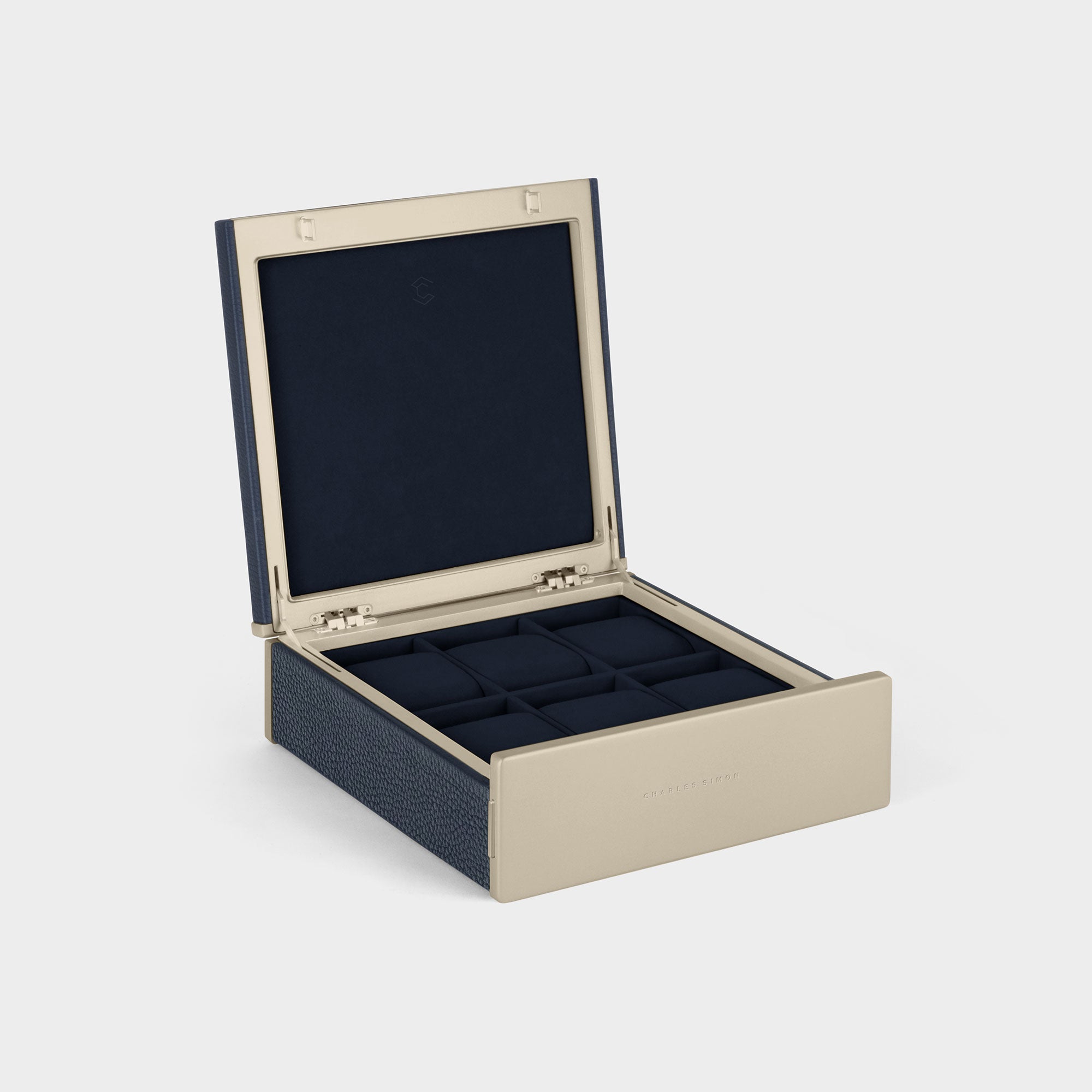 Product photo of open Spence 6 Watch box featuring gold accents, marine leather and removable watch cushions in deep blue Alcantara for up to 6 watches