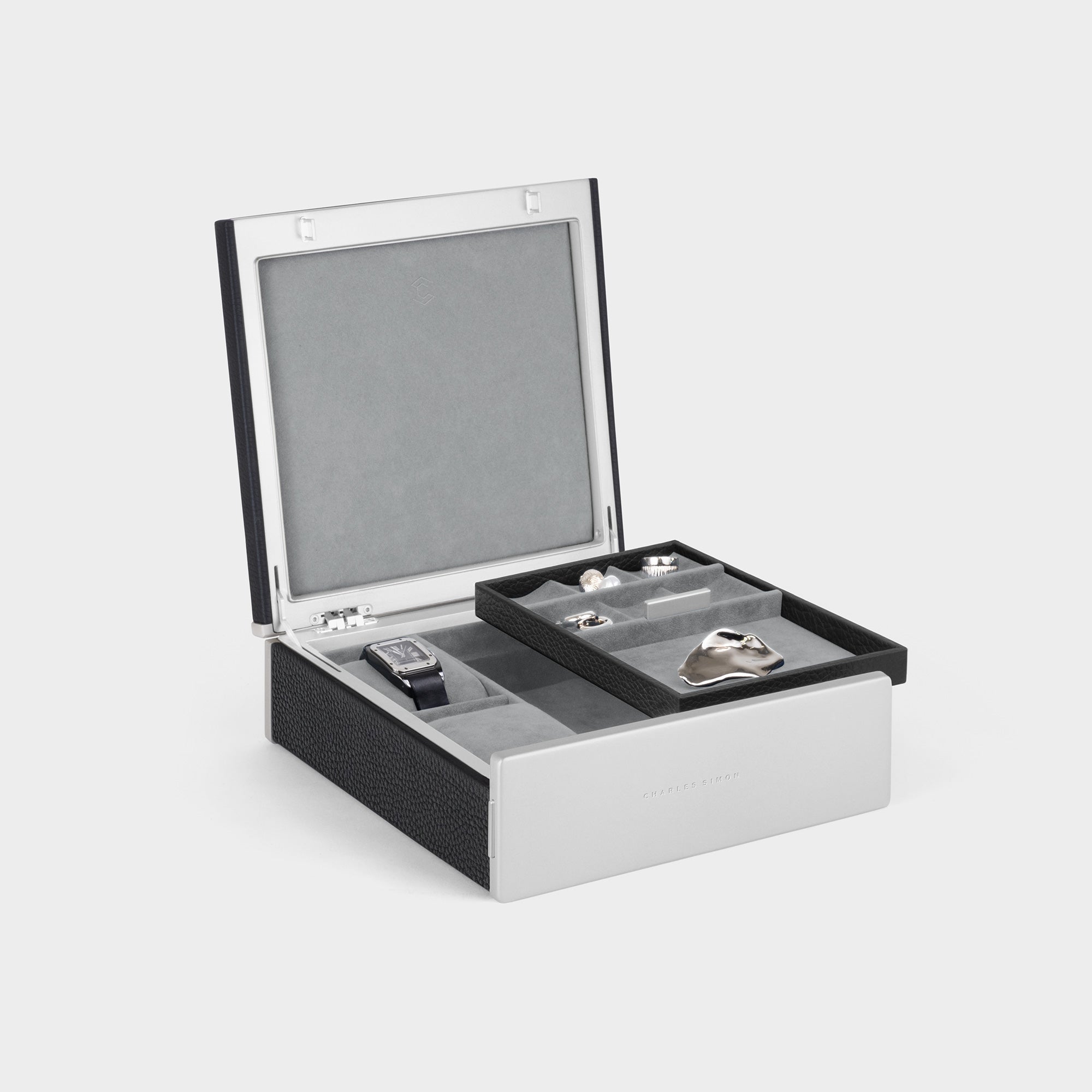 Product photo of open Taylor 2 Watch and Jewelry box in black leather and fog grey interior, featuring a removable jewelry tray with convenient compartments that organize and store your rings, earrings, bracelets and necklaces as well as two watches.