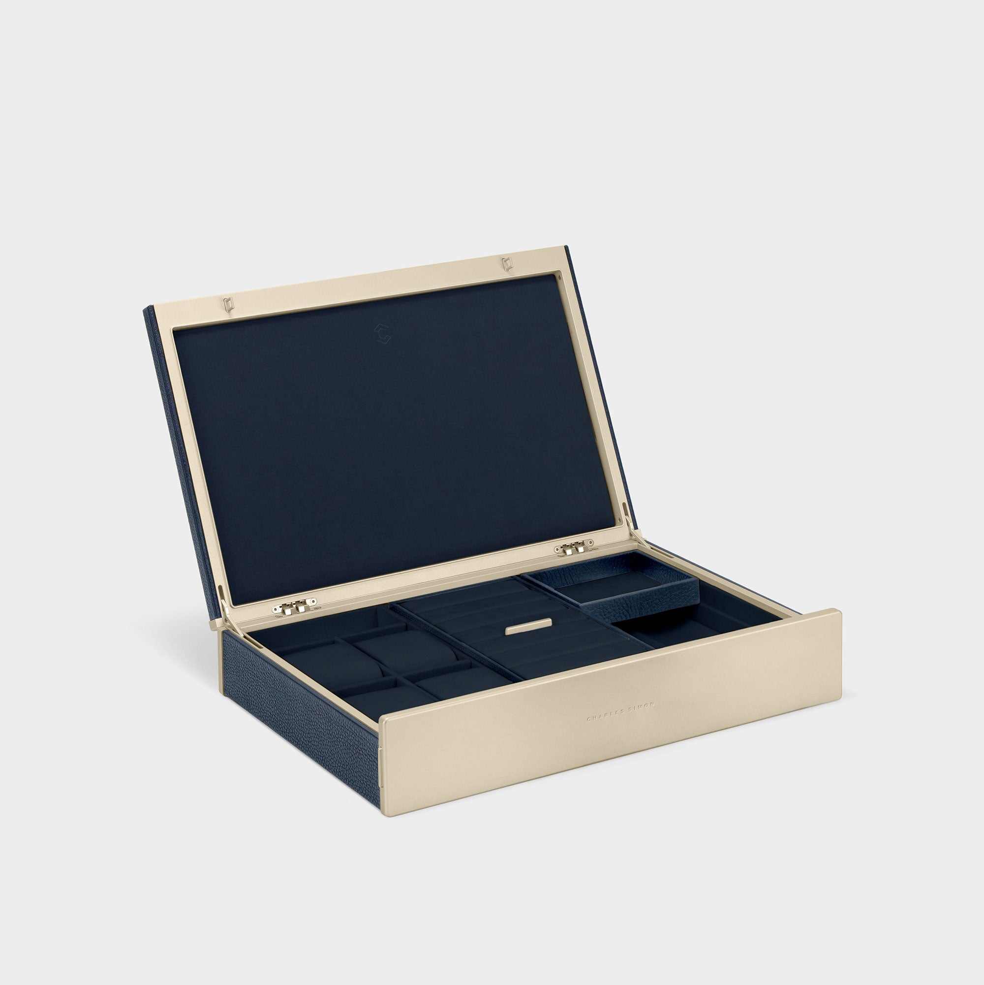 Product photo of open Taylor 4 gold luxury watch and jewelry box featuring marine young bull leather and a carbon fiber and anodized aluminum frame. Handmade in Canada to organize your jewelry and watches.
