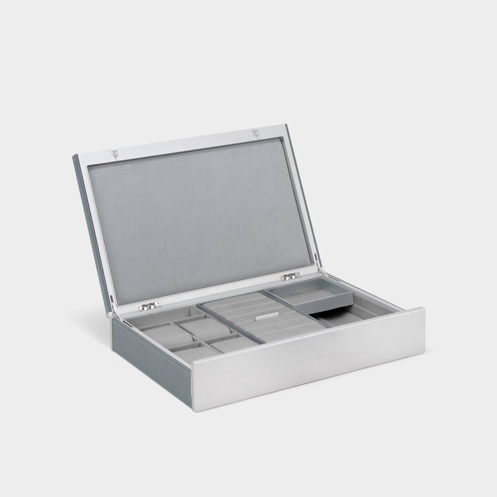 Product photo of open Taylor 4 Watch and Jewelry box in cloud grey leather and fog grey interior. Handmade watch and jewelry storage featuring room for 4 watches and removable compartments and trays for necklaces, bracelets, rings and earrings.