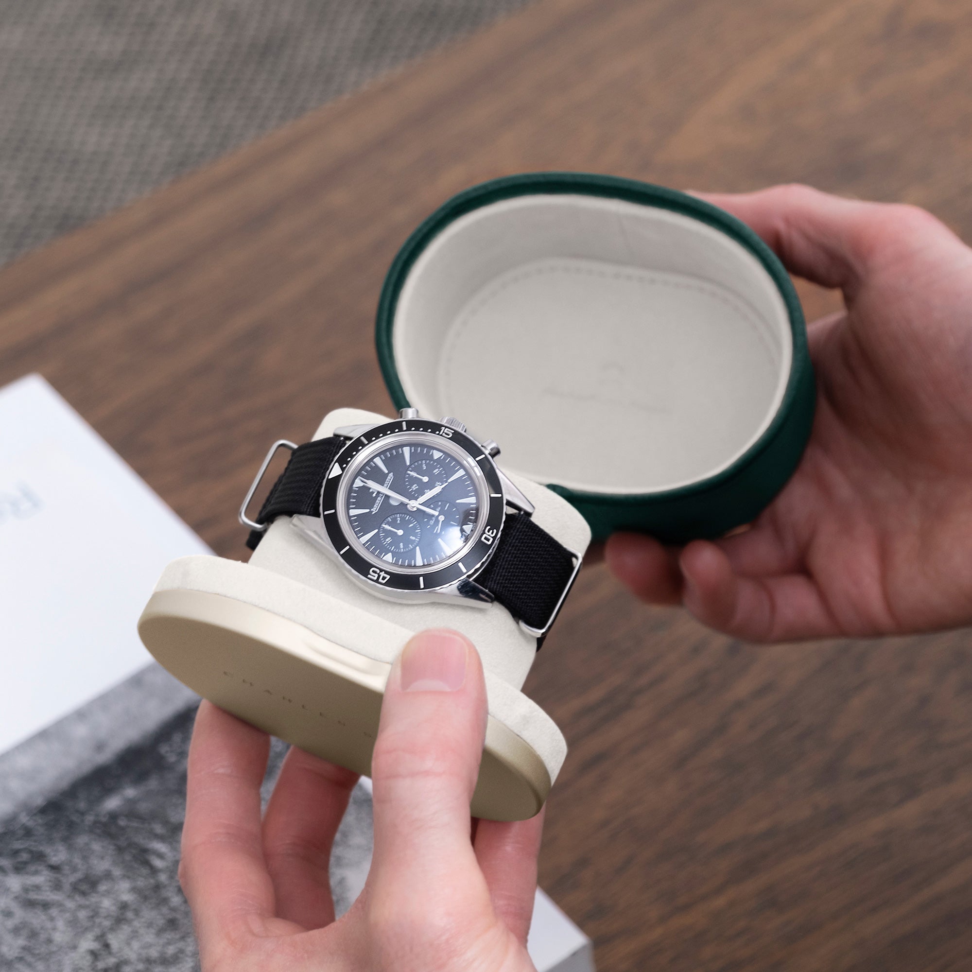 Lifestyle photo of Theo Leather Watch roll by Charles Simon. Handmade from gold casing and emerald French bull leather