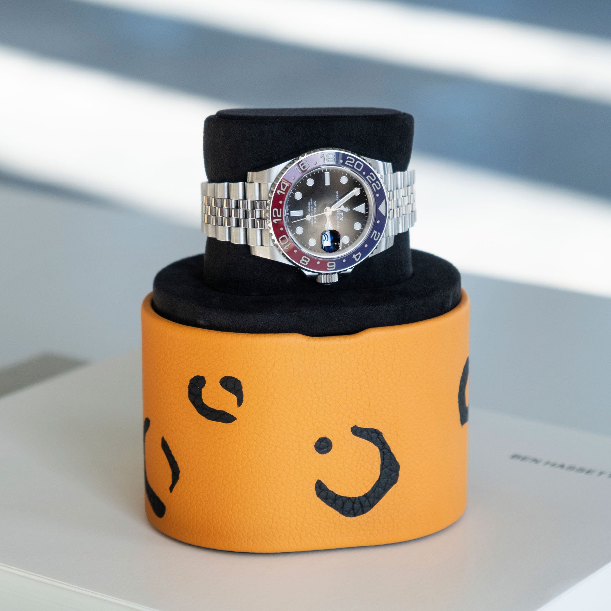Luxury watch displayed on leopard Theo Watch roll in convenient portable watch stand position 
