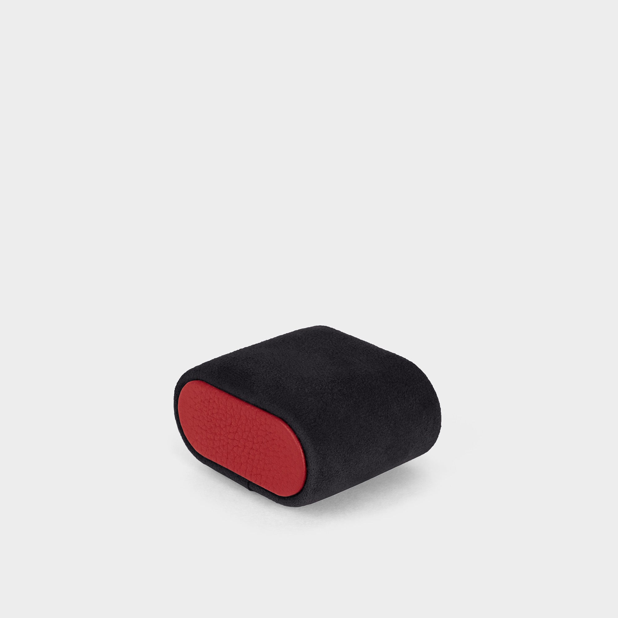 Watch cushion made from black, soft Alcantara featuring contrasting red leather accents. Custom sizing available.