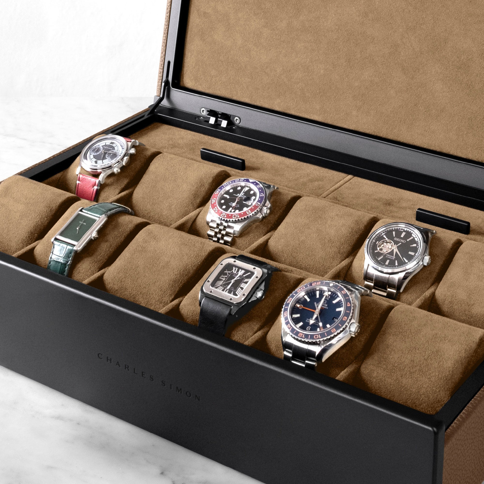 Luxury watches displayed in tan leather and camel Alcantara Spence 12 luxury Watch box.