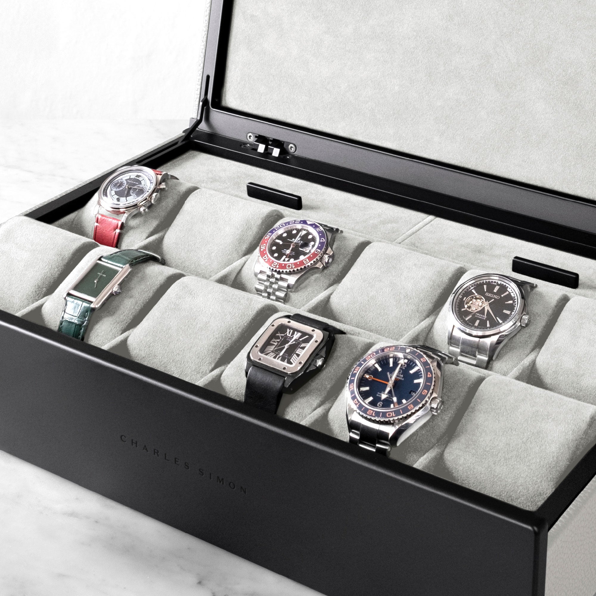 Luxury watches displayed in Spence 12 Watch box in white Alcantara and black casing 