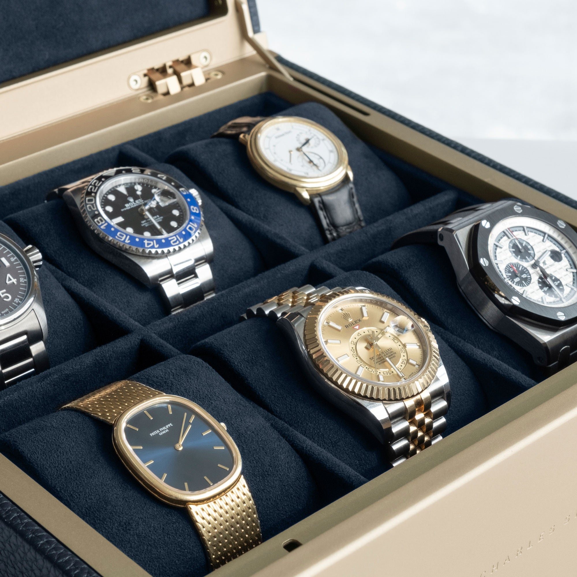 Detail photo of watch collection of 6 watches displayed in the gold Spence 6 watch box in marine leather.