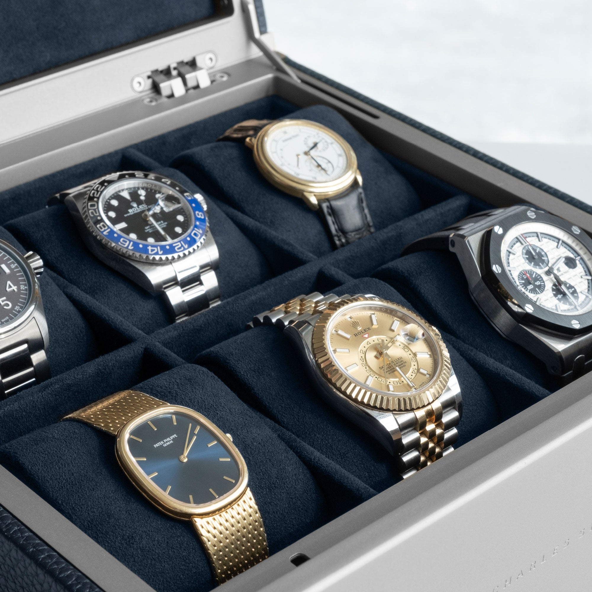 Detail photo of watch collection of 6 watches displayed in the Charles Simon x Paris Watch Club limited edition Spence 6 watch box in marine leather.