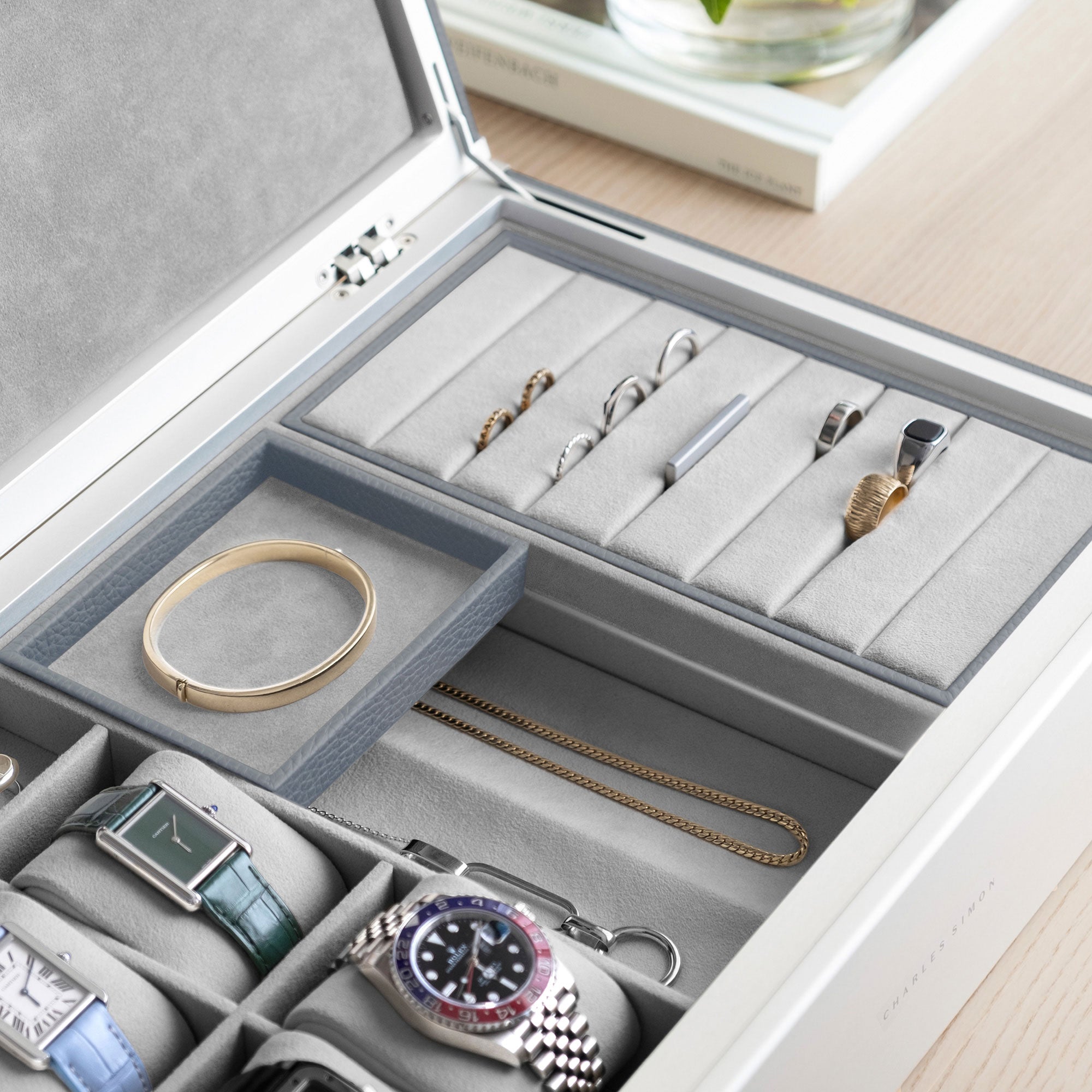Detail shot of Taylor 4 Watch and Jewelry box in cloud grey leather and fog grey interior showing the movable jewelry organization compartments of the handmade watch and jewelry storage box.