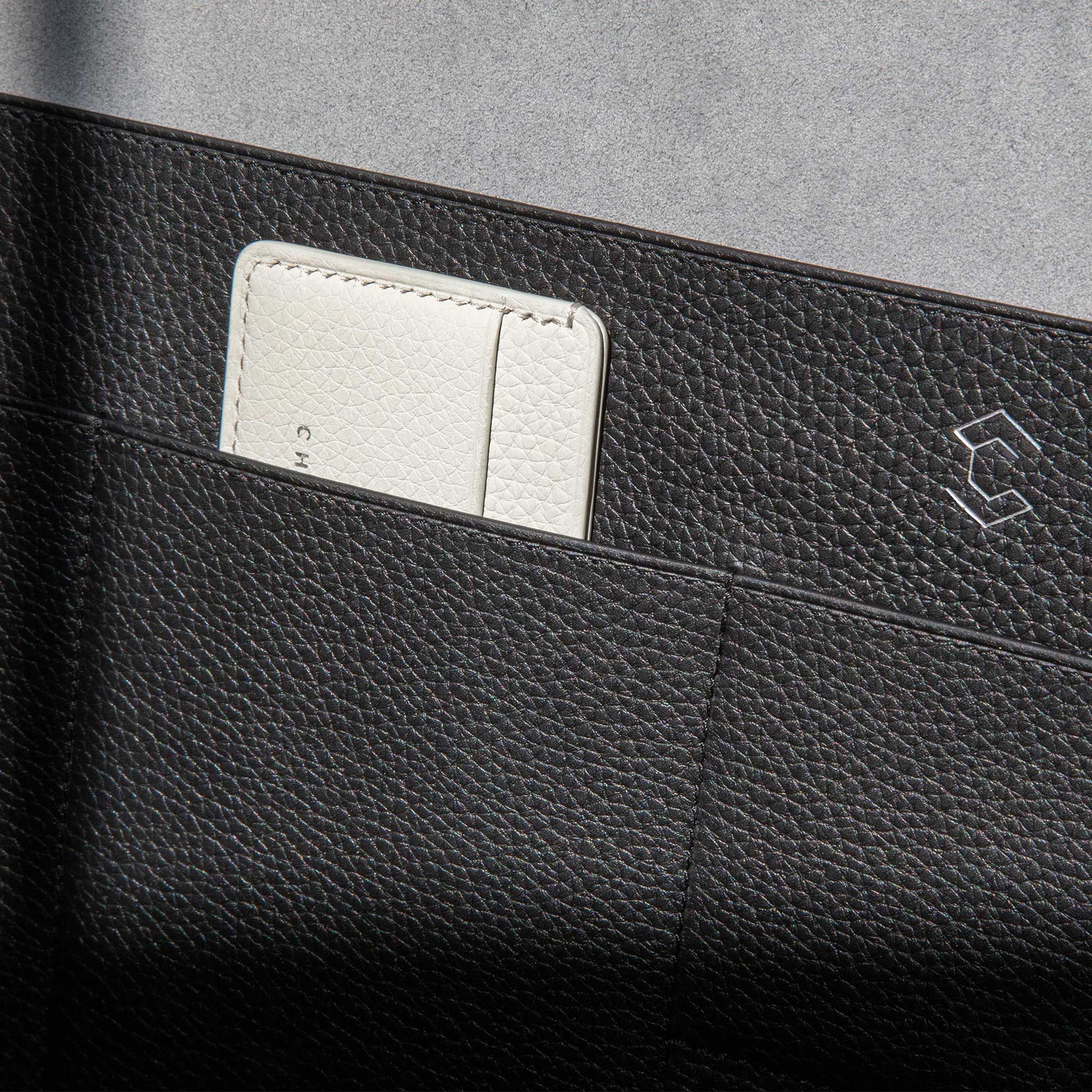 Detail shot of briefcase compartments made from premium French young bull leather