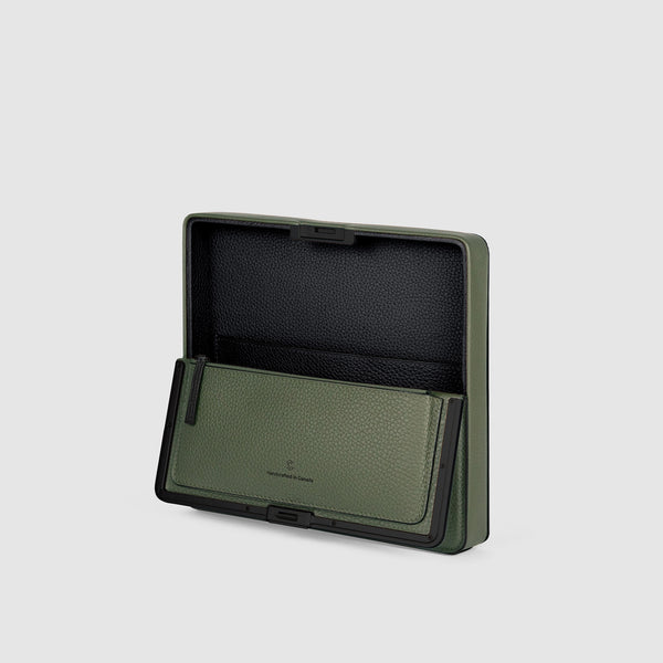 Product shot of open Fraser travel wallet in khaki with black contrasting edges showing the convenient zipped pouch and large central compartment
