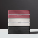 Lifestyle shot of three stacked Moraine toiletry bags by Charles Simon